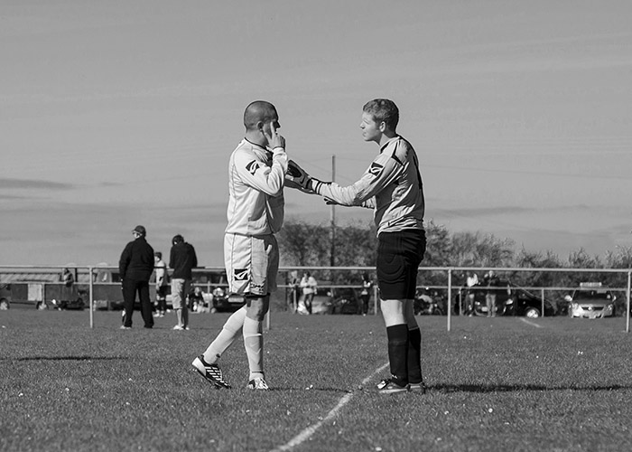 Two men on a field

Description automatically generated with low confidence