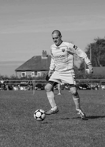 A person playing football

Description automatically generated with medium confidence